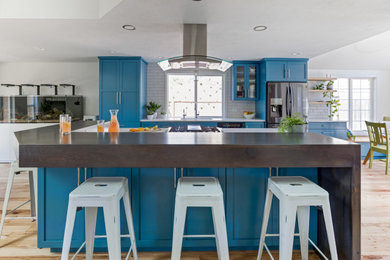 Inspiration for a large contemporary single-wall open concept kitchen remodel in Other with shaker cabinets, turquoise cabinets, quartz countertops, an island and gray countertops
