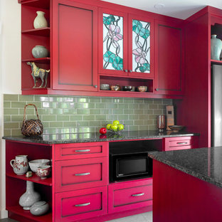 Mid-sized arts and crafts u-shaped separate kitchen in Other with shaker cabinets, red cabinets, quartz benchtops, green splashback, ceramic splashback, stainless steel appliances, with island, black benchtop, an undermount sink, ceramic floors and grey floor.