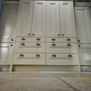 Large victorian l-shaped separate kitchen in Other with a farmhouse sink, beaded inset cabinets, beige cabinets, black splashback, slate splashback, coloured appliances, slate floors and beige floor.