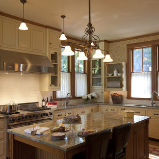 This is an example of a victorian kitchen in Boston with beaded inset cabinets, stainless steel appliances, subway tile splashback and granite benchtops.