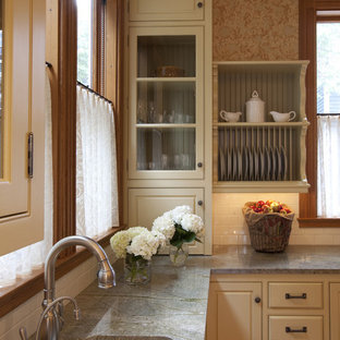 Victorian kitchen in Boston with beaded inset cabinets, subway tile splashback, a single-bowl sink, granite benchtops and beige cabinets.