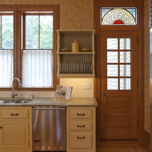 This is an example of a victorian kitchen in Boston with stainless steel appliances.
