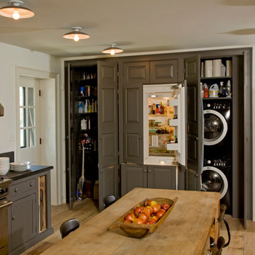 View of the built-in pantry, refridgerator, washer/dryer