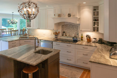 Inspiration for a large transitional medium tone wood floor and brown floor eat-in kitchen remodel in New York with an undermount sink, recessed-panel cabinets, white cabinets, quartzite countertops, beige backsplash, stone tile backsplash, an island and brown countertops
