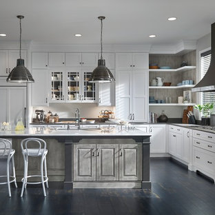 Huge transitional open concept kitchen ideas - Inspiration for a huge transitional l-shaped open concept kitchen remodel in Minneapolis with flat-panel cabinets, white cabinets, quartz countertops, white backsplash, paneled appliances and an island