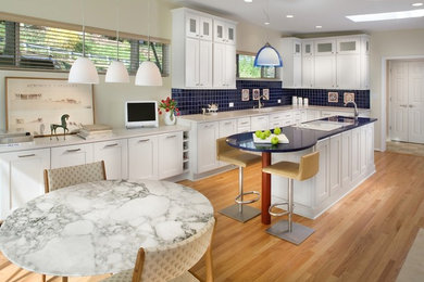 Eat-in kitchen - modern l-shaped eat-in kitchen idea in DC Metro with shaker cabinets, white cabinets, blue backsplash and blue countertops