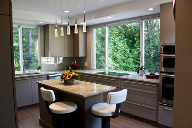 Mid-sized trendy u-shaped light wood floor and gray floor eat-in kitchen photo in Boston with an undermount sink, gray cabinets, quartzite countertops, beige backsplash, porcelain backsplash, stainless steel appliances and gray countertops