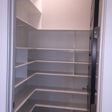 walk in pantry with floor to ceiling shelves