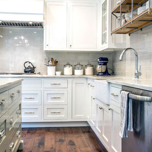 Photo of a mid-sized modern galley separate kitchen in Sydney with a drop-in sink, louvered cabinets, grey cabinets, laminate benchtops, white splashback, porcelain splashback, stainless steel appliances, porcelain floors and with island.