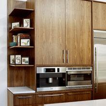 bookshelf next to fridge