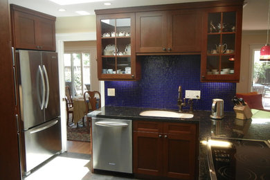 Inspiration for a mid-sized contemporary l-shaped light wood floor open concept kitchen remodel in San Francisco with an undermount sink, shaker cabinets, medium tone wood cabinets, granite countertops, blue backsplash, mosaic tile backsplash and stainless steel appliances