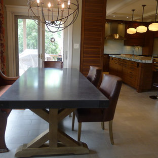 Design ideas for a contemporary u-shaped eat-in kitchen in Indianapolis with an integrated sink, medium wood cabinets, soapstone benchtops, green splashback and stainless steel appliances.
