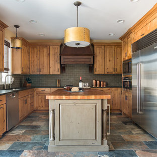 Inspiration for a mid-sized country u-shaped eat-in kitchen in Chicago with an undermount sink, shaker cabinets, light wood cabinets, granite benchtops, grey splashback, stainless steel appliances, porcelain floors, multi-coloured floor and slate splashback.