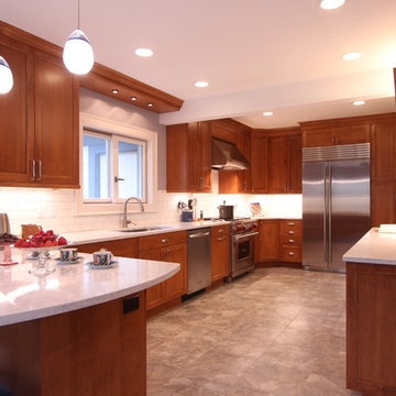 Warm Medium Stained Maple Cabinets with Marble Looking Quartz