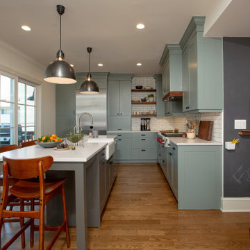 Warm Open Kitchen with Blue/Gray/Green Cabinets and Dark Wood