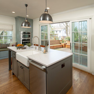 Warm Open Kitchen with Blue/Gray/Green Cabinets and Dark Wood