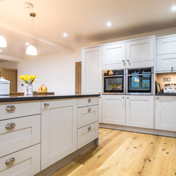 Warm Traditional Open Plan kitchen with a splash of colour