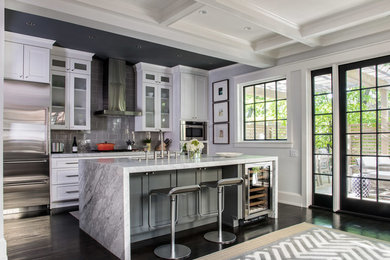 Kitchen - contemporary dark wood floor kitchen idea in DC Metro with white cabinets, an island, gray backsplash, subway tile backsplash, stainless steel appliances, gray countertops and shaker cabinets