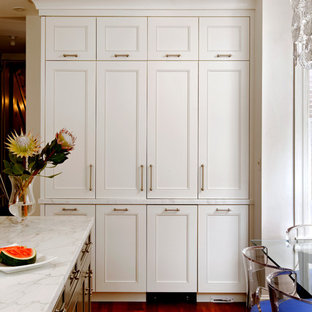 Design ideas for a mid-sized traditional l-shaped open plan kitchen in DC Metro with an undermount sink, white cabinets, wood benchtops, white splashback, stainless steel appliances, medium hardwood floors, with island, louvered cabinets and stone tile splashback.