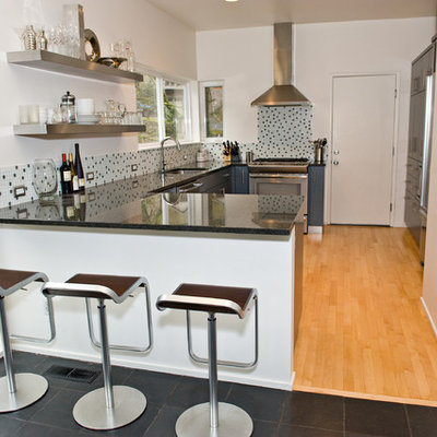 Minimalist u-shaped kitchen photo in Portland with multicolored backsplash, mosaic tile backsplash, open cabinets and stainless steel cabinets