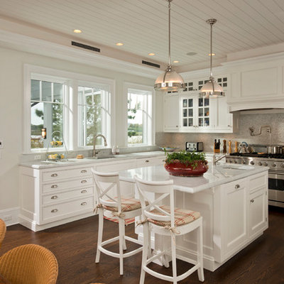 Inspiration for a mid-sized timeless u-shaped dark wood floor open concept kitchen remodel in New York with an undermount sink, white cabinets, quartzite countertops, multicolored backsplash, stainless steel appliances, an island and beaded inset cabinets
