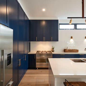 Kitchen with blue shaker cabinets