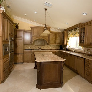 This is an example of a tropical kitchen in Miami with raised-panel cabinets, light wood cabinets, laminate benchtops, beige splashback, ceramic splashback and with island.