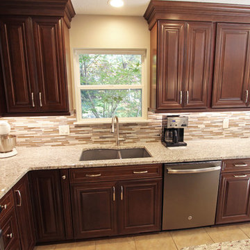 Waypoint Cherry Chocolate Cabinets and Giallo Ornamental Granite Countertops