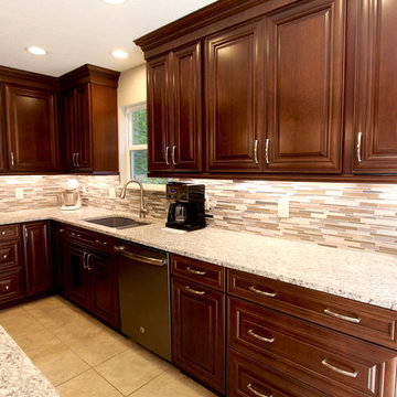 Waypoint Cherry Chocolate Cabinets and Giallo Ornamental Granite Countertops