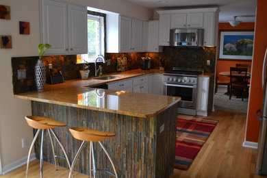 Kitchen - large transitional u-shaped light wood floor and beige floor kitchen idea in Detroit with an undermount sink, multicolored backsplash, ceramic backsplash and no island