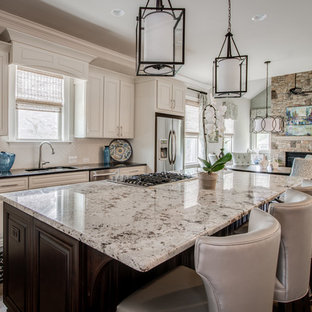 Mid-sized transitional eat-in kitchen photos - Inspiration for a mid-sized transitional l-shaped dark wood floor eat-in kitchen remodel in Charlotte with an undermount sink, raised-panel cabinets, white cabinets, granite countertops, white backsplash, subway tile backsplash, stainless steel appliances and an island