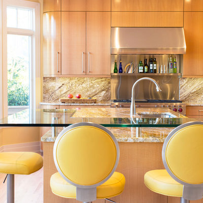 Kitchen - contemporary kitchen idea in Baltimore with an undermount sink, flat-panel cabinets, medium tone wood cabinets, stainless steel appliances, an island and yellow countertops