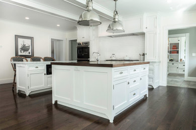 Inspiration for a large timeless eat-in kitchen remodel in Boston with shaker cabinets, white cabinets, marble countertops, white backsplash, subway tile backsplash, stainless steel appliances, two islands and white countertops
