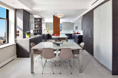 Trendy u-shaped eat-in kitchen photo in New York with an integrated sink