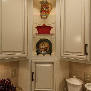 Inspiration for a large shabby-chic style u-shaped eat-in kitchen in Atlanta with a double-bowl sink, raised-panel cabinets, beige cabinets, granite benchtops, beige splashback, stone tile splashback, stainless steel appliances, dark hardwood floors and no island.