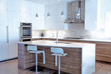 Mid-sized trendy l-shaped porcelain tile eat-in kitchen photo in Calgary with an undermount sink, flat-panel cabinets, medium tone wood cabinets, quartz countertops, multicolored backsplash, stone tile backsplash, white appliances and an island