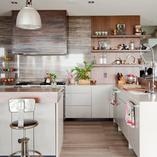 This is an example of a mid-sized contemporary l-shaped kitchen in Vancouver with a double-bowl sink, open cabinets, medium wood cabinets, stainless steel appliances, with island, stone slab splashback, porcelain floors and brown floor.