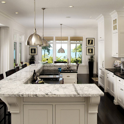 Large elegant galley dark wood floor eat-in kitchen photo in Grand Rapids with recessed-panel cabinets, white cabinets and marble countertops
