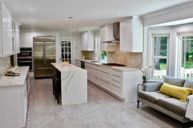 Inspiration for a large contemporary galley porcelain tile and gray floor eat-in kitchen remodel in Boston with an undermount sink, shaker cabinets, white cabinets, quartz countertops, white backsplash, stone slab backsplash, stainless steel appliances, an island and white countertops
