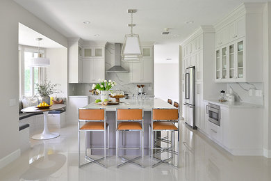 Example of a large transitional u-shaped porcelain tile and white floor eat-in kitchen design in Other with a farmhouse sink, flat-panel cabinets, white cabinets, granite countertops, white backsplash, marble backsplash, stainless steel appliances, an island and white countertops