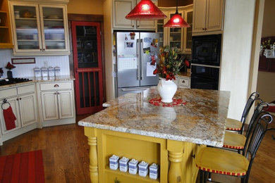Inspiration for a mid-sized eclectic kitchen remodel in Denver with granite countertops and an island