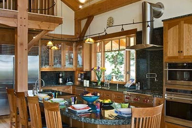 Example of a huge mountain style kitchen design in Denver with granite countertops and an island