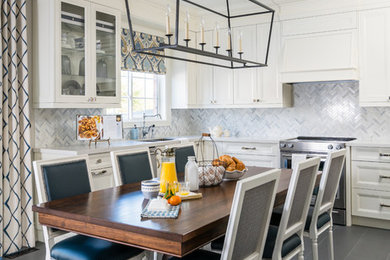 Eat-in kitchen - transitional gray floor eat-in kitchen idea in Toronto with an undermount sink, recessed-panel cabinets, white cabinets, white backsplash and marble backsplash