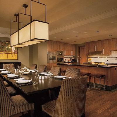 Example of a trendy eat-in kitchen design in Vancouver with stainless steel appliances, flat-panel cabinets, medium tone wood cabinets, white backsplash and subway tile backsplash