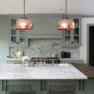 Example of a small transitional l-shaped medium tone wood floor and brown floor eat-in kitchen design in Other with an undermount sink, shaker cabinets, green cabinets, gray backsplash, an island, gray countertops, marble countertops, marble backsplash and stainless steel appliances