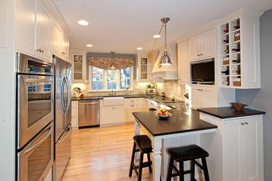 Example of a classic kitchen design in Other