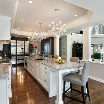 White and Gray Open Kitchen with Tray Ceiling, Crystal Chandeliers and Lar