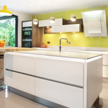 White & wood effect matt kitchen with yellow wall