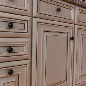White cabinets to putty cream with taupe detailing