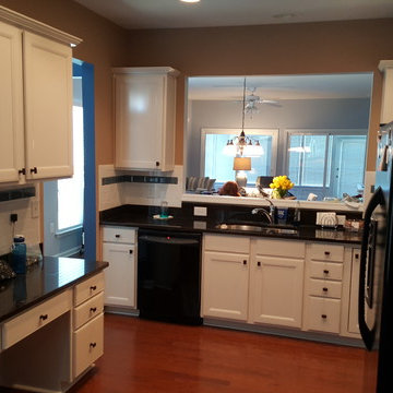White Cabinets with Black Handles and Appliances
